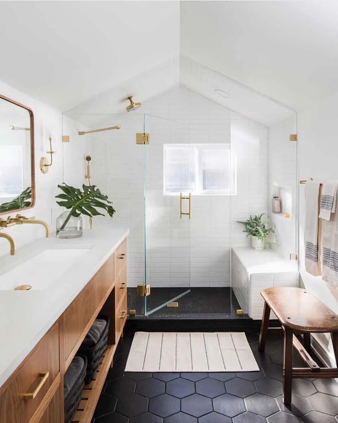 Warm Up Dark Hexagon Tiles with Brass Fixtures