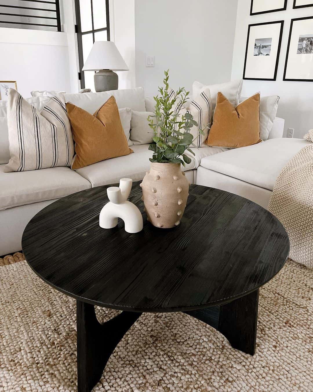Textured Black Table with Modern Sculptures
