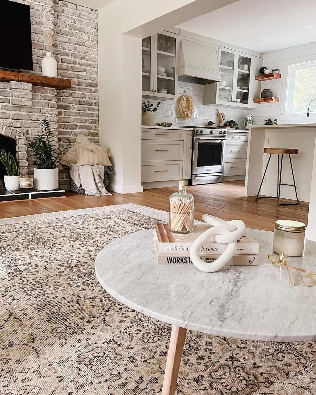 Styling Your Round Table with Books and Sculptures