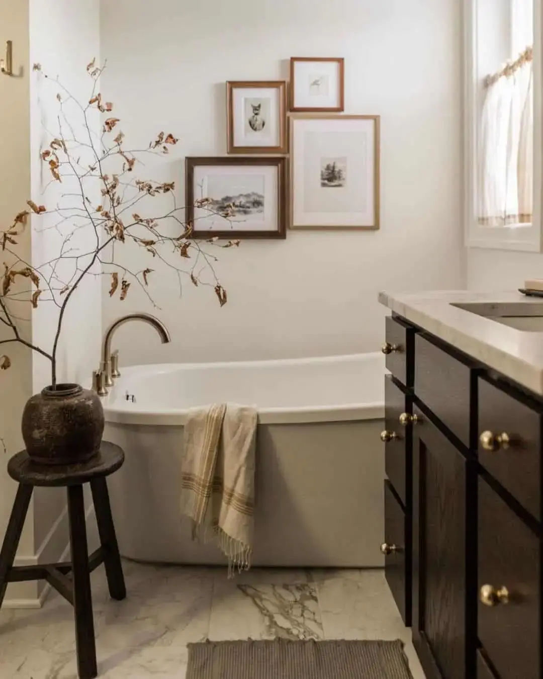 Four Varied Wood Frames Create a Dynamic Bathroom Gallery