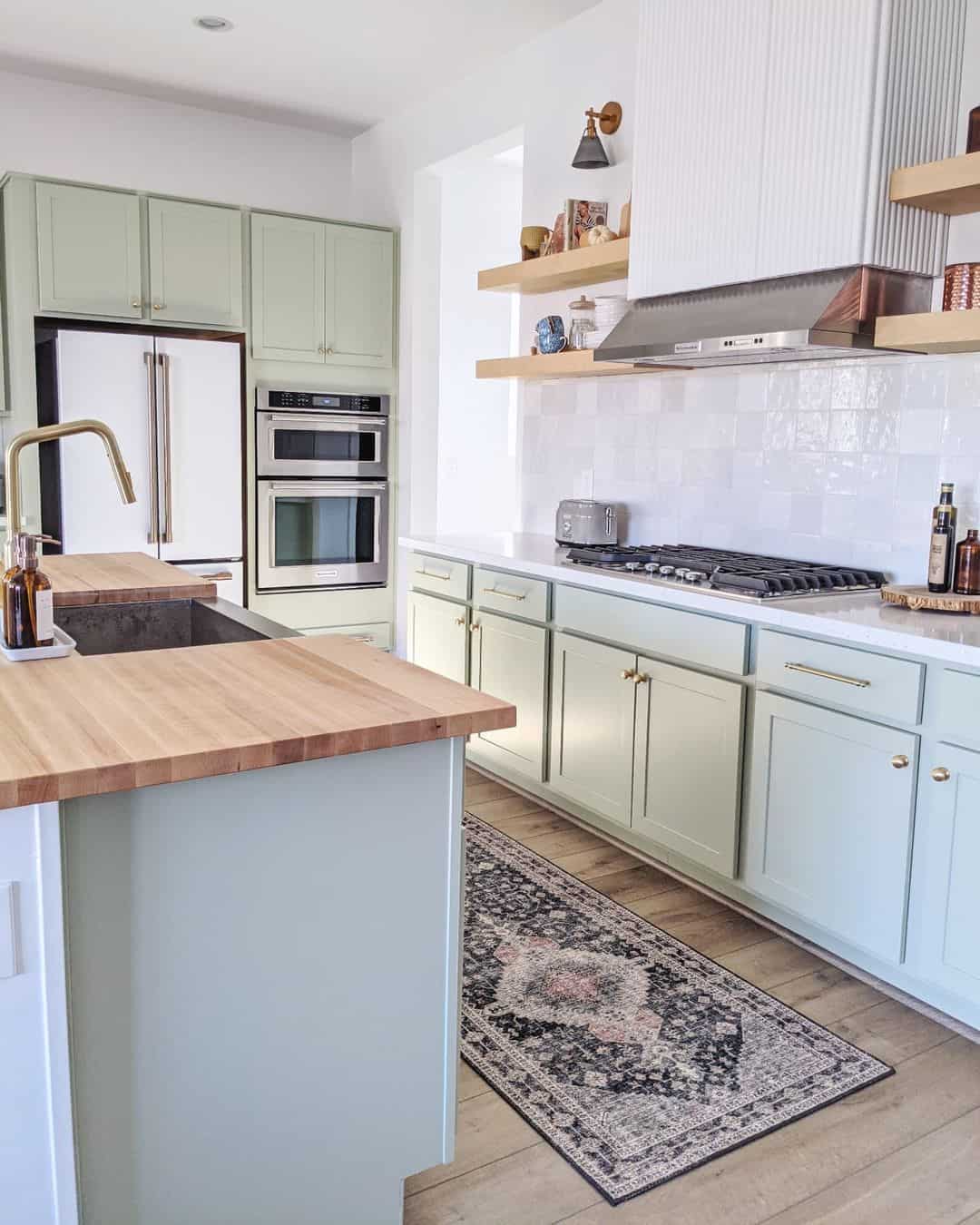 Distressed Runner Adds Pattern Under Mint Green Cabinets