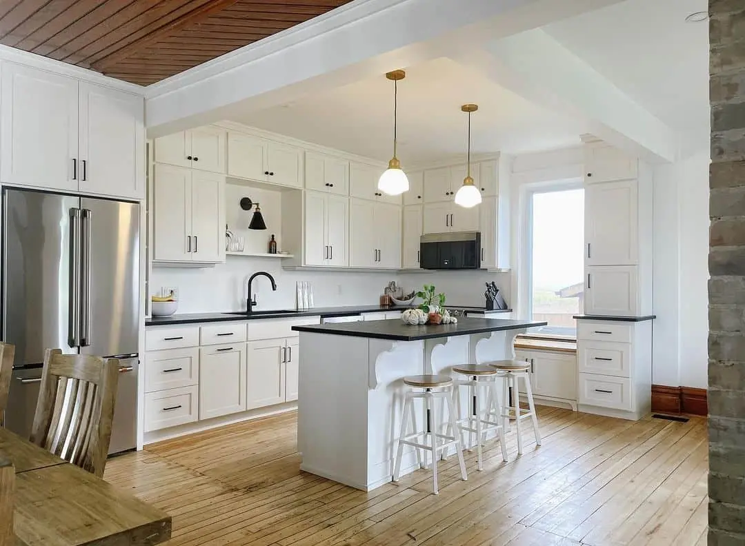 Wide Plank Wood Floors Add Warmth to White Kitchens