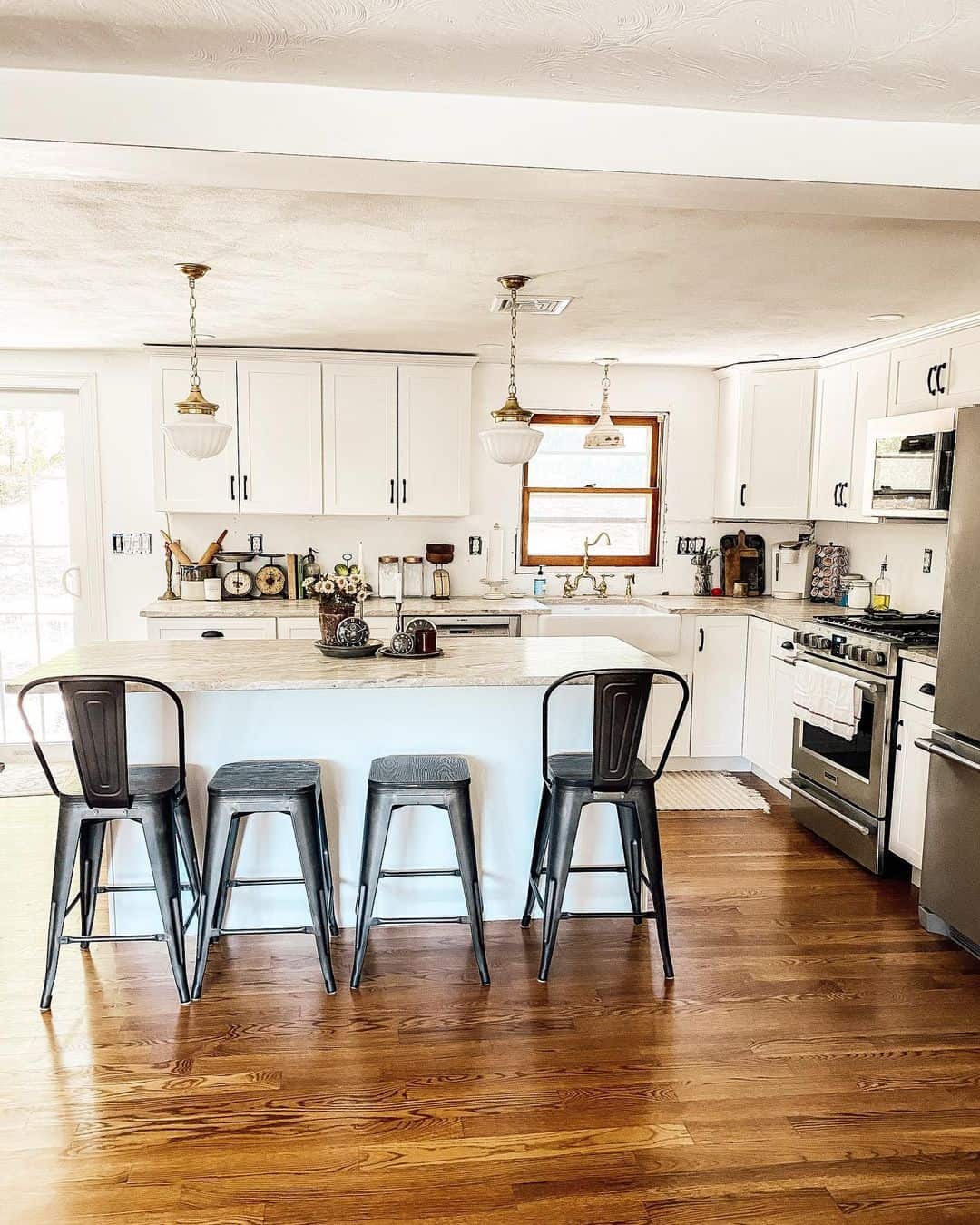 Rich Red Oak Floors Define a Bright White Kitchen