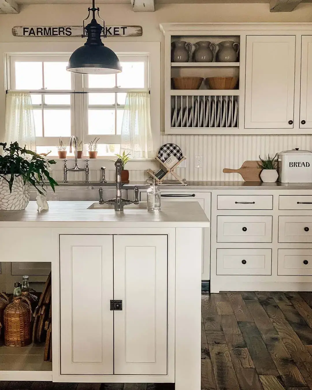 Dark Wood Floors Add Depth to a Bright Farmhouse Kitchen