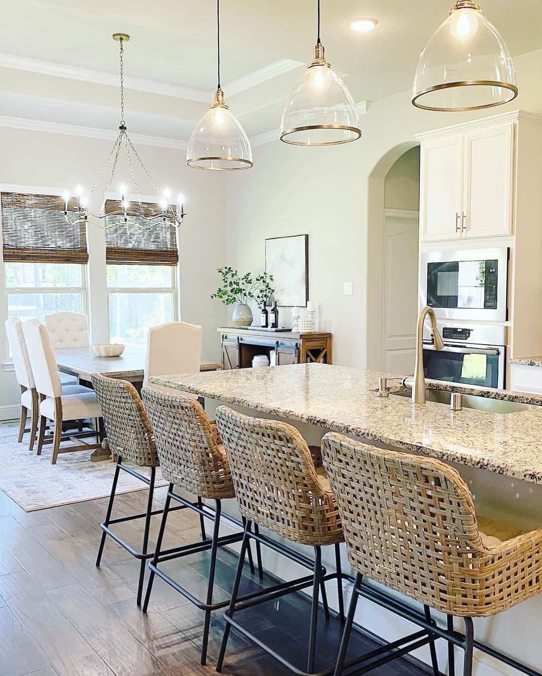 Clear Dome Pendants with Brass Trim Define the Island