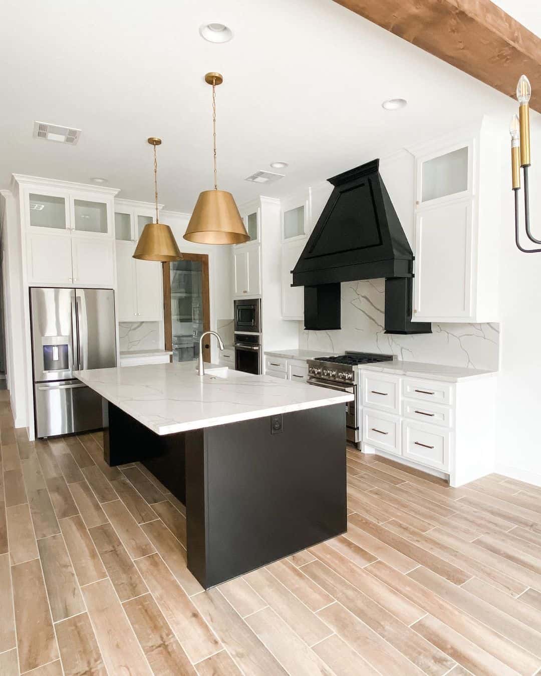 Warm Brass Cone Pendants Define the Island