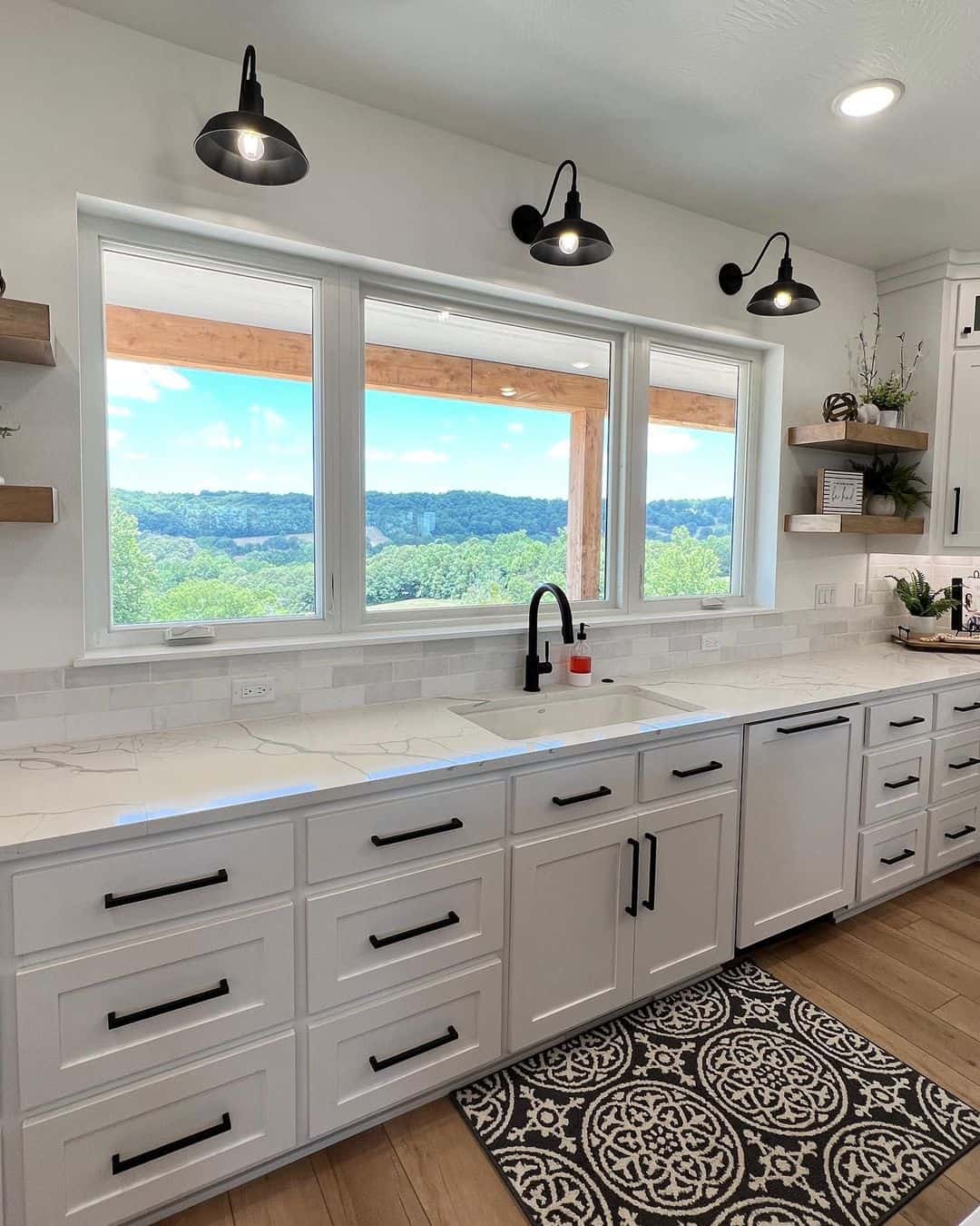 Pair a Farmhouse Sink with a Black Faucet and Marble Countertops
