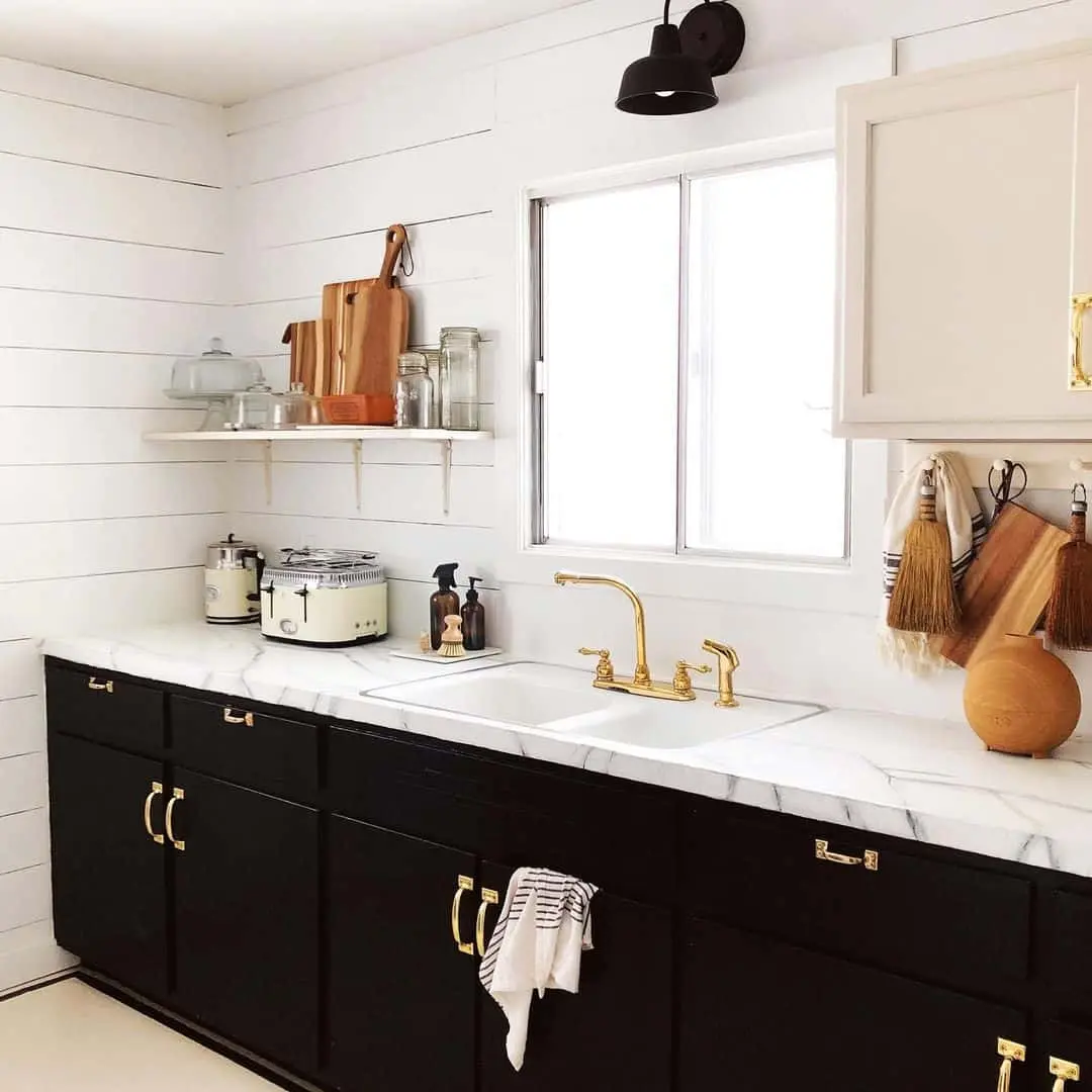 Contrast Dark Cabinets with Bright Marble-Look Countertops