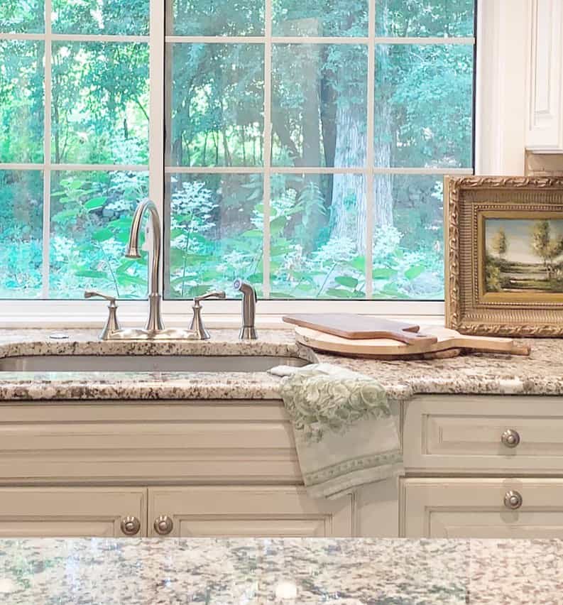 Framed Landscape Painting Adds Artful Charm Above the Sink