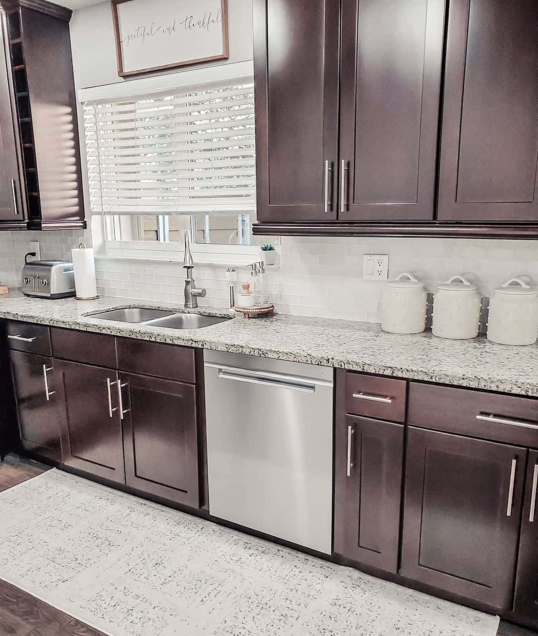White Ceramic Canisters Organize Countertops Near the Sink