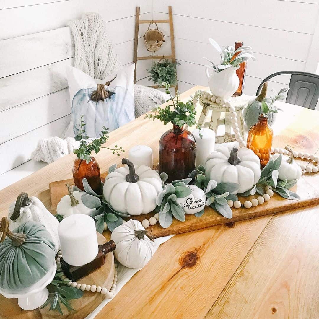 Layered Pumpkins and Amber Bottles for Autumn Display