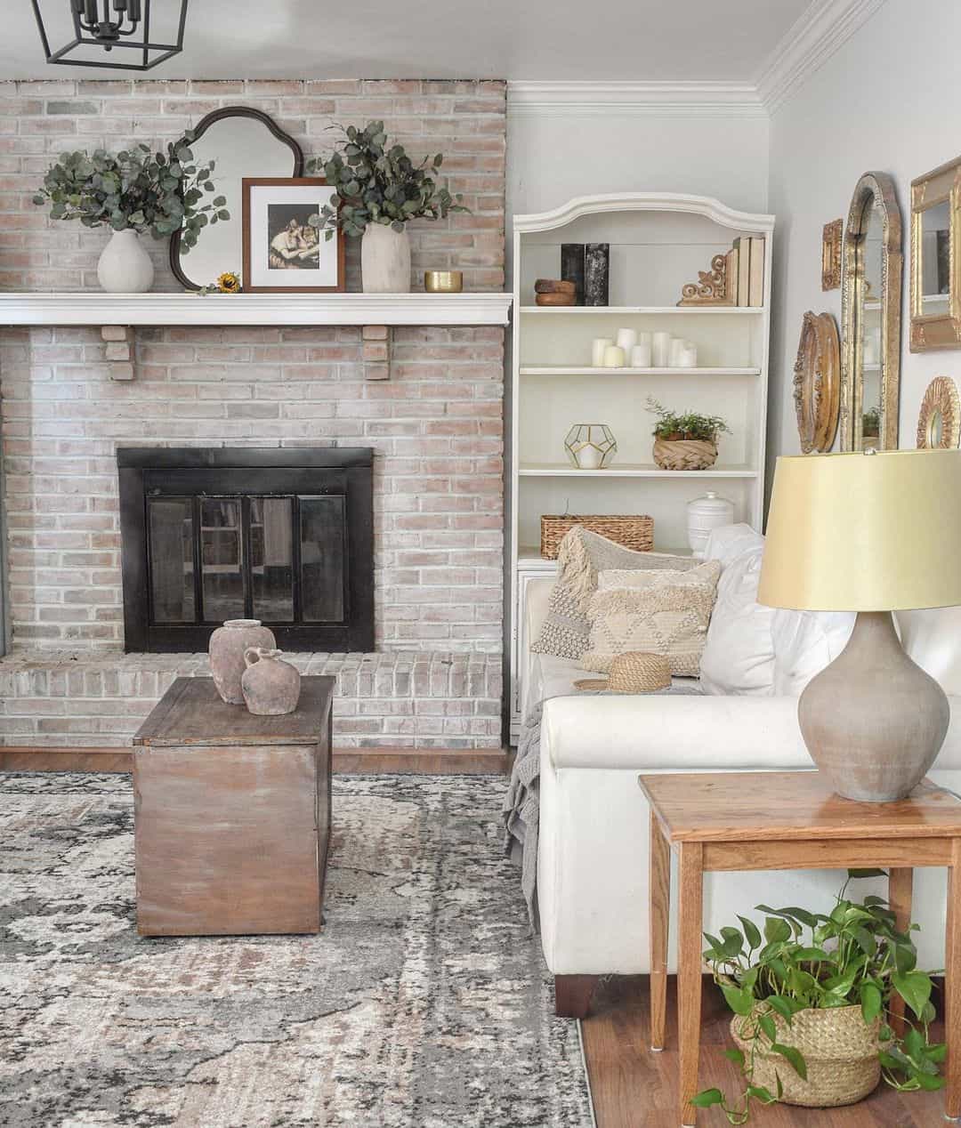 Layered Mantel Decor Adds Depth Above Limewash Brick