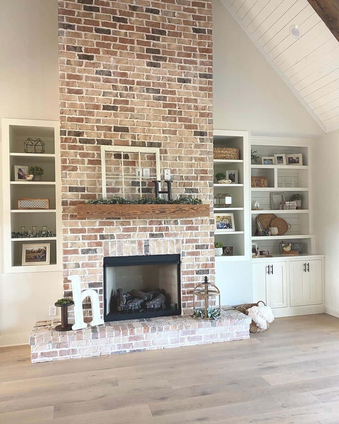 White Built-in Shelving Frames Fireplace
