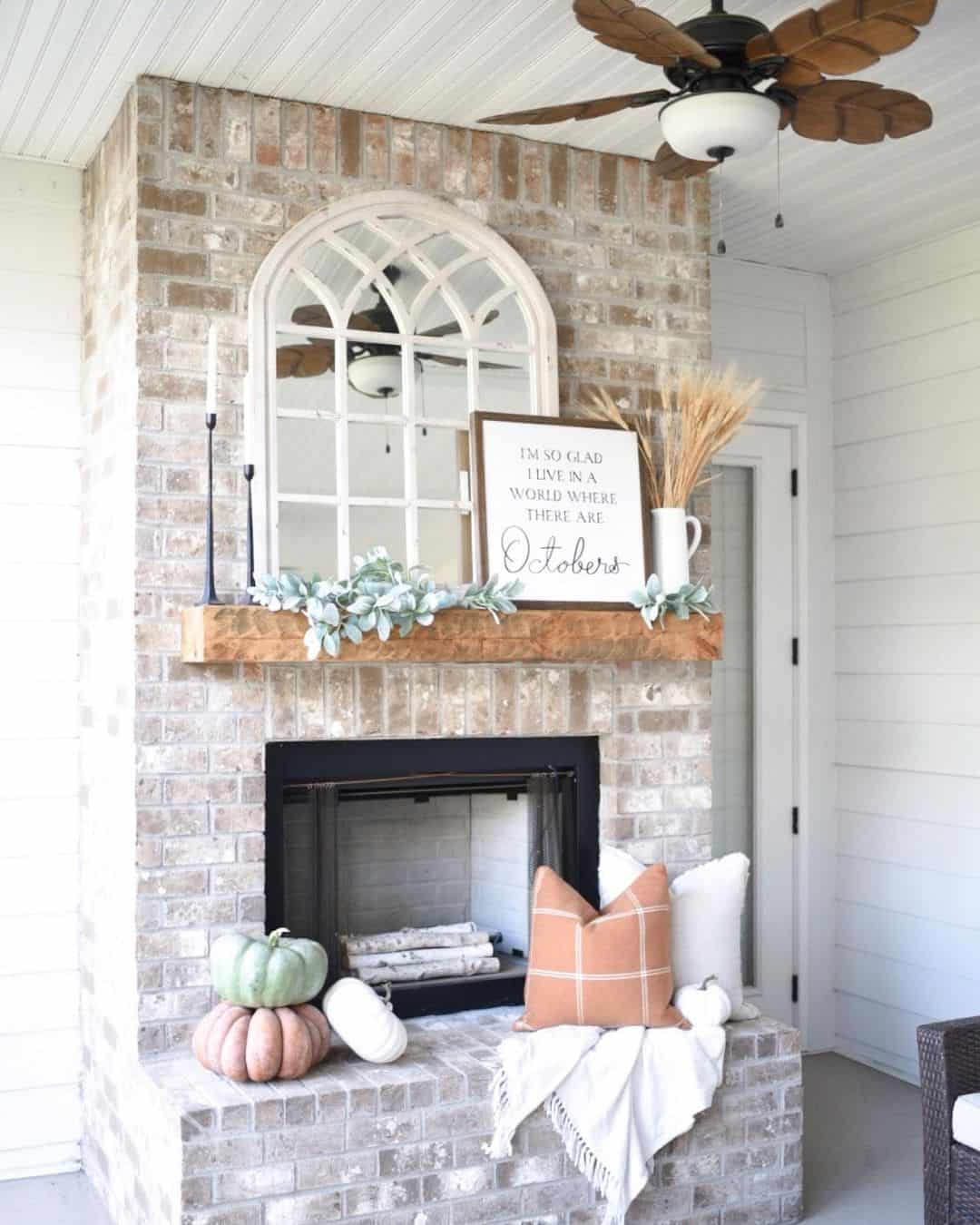 Arched Mirror Reflects Light Above Wooden Mantel