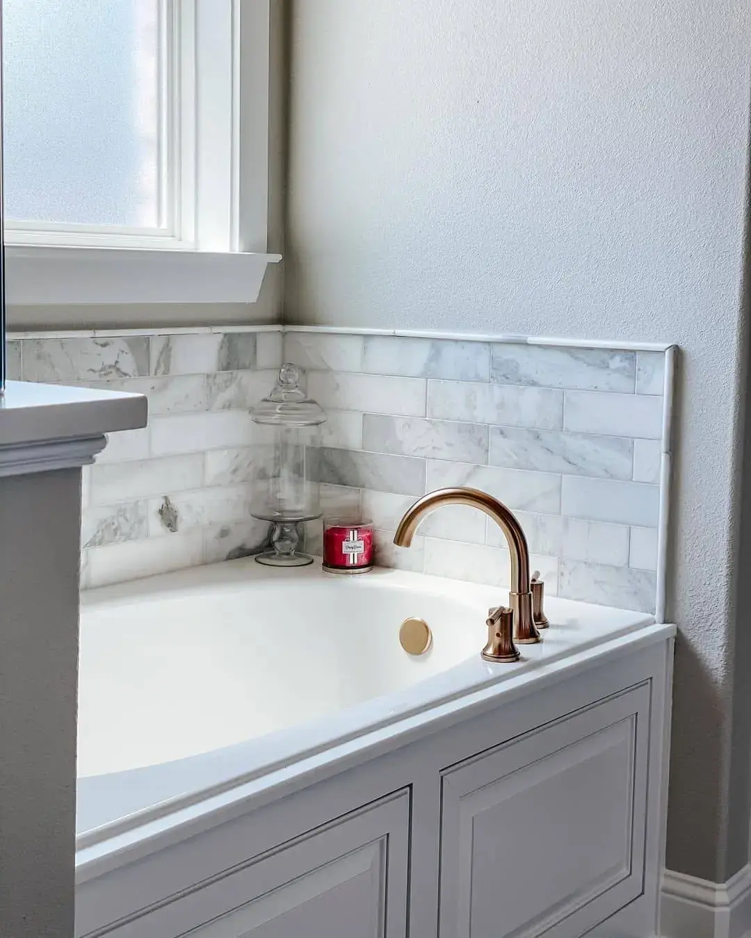 Marble Subway Tile Backsplash Behind the Tub