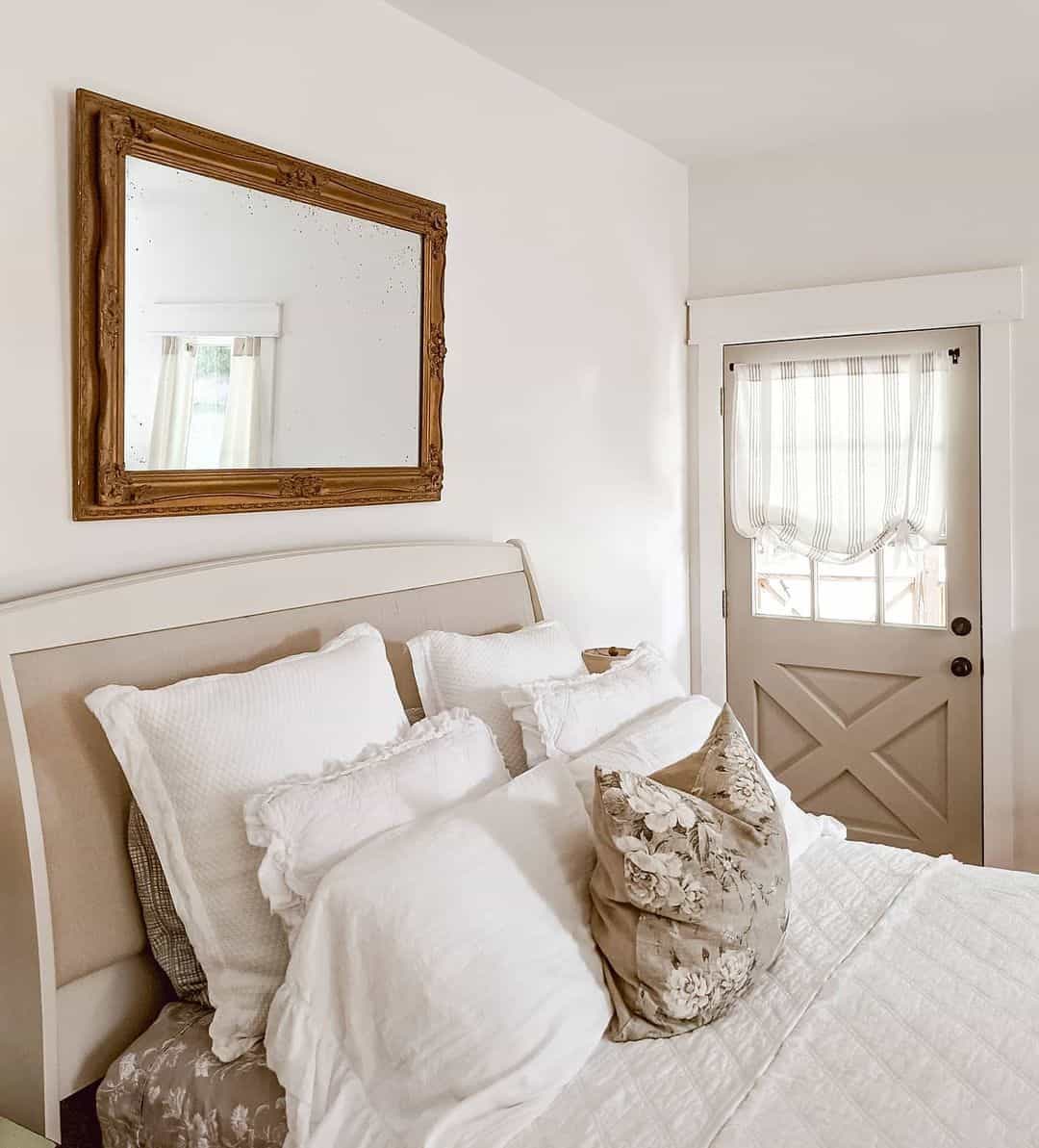 Ornate Gold Mirror Frames A Softly Lit Bedroom