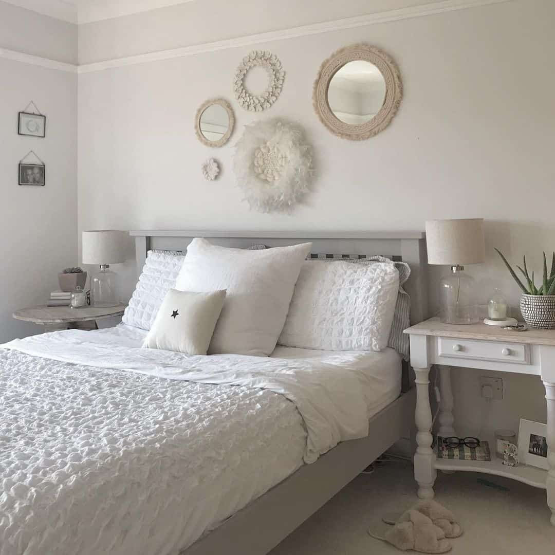 Grouped Textured Mirrors Create A Gallery Above The Headboard