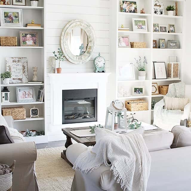 Textured Oval Mirror Adds Dimension Above White Mantel