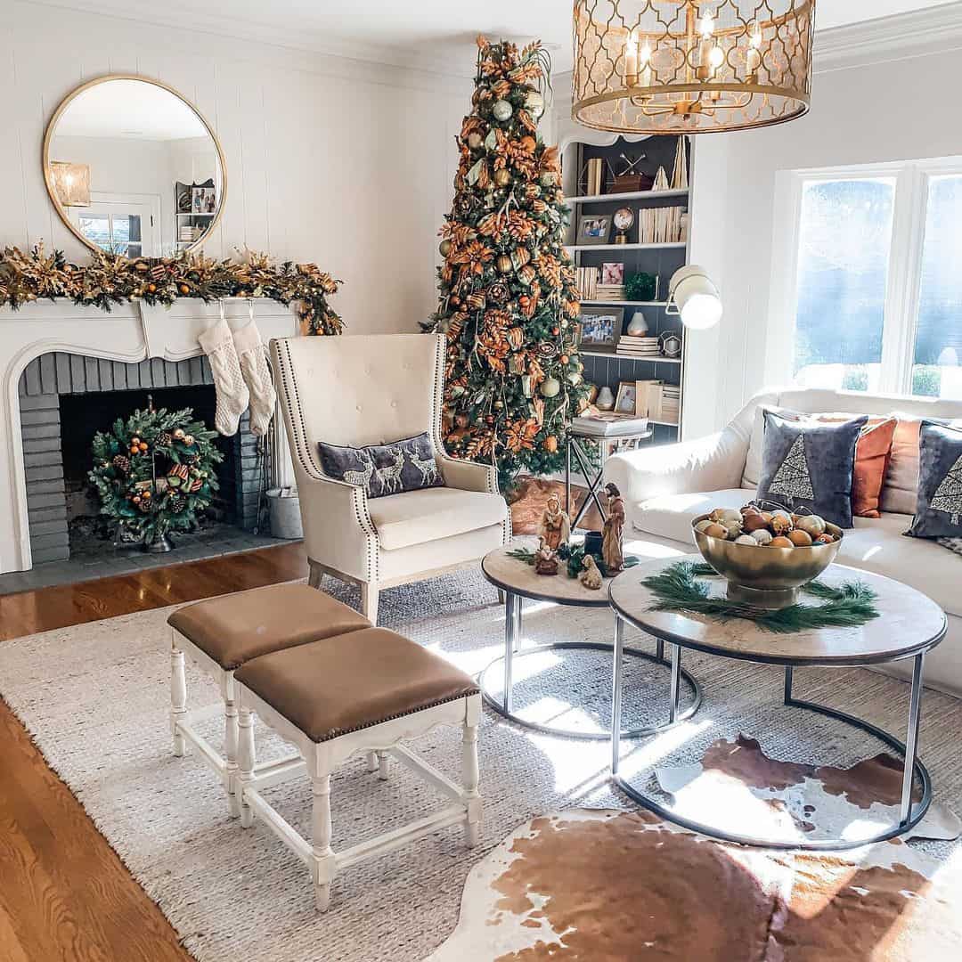 Round Mirror Reflects Festive Garland Above Fireplace