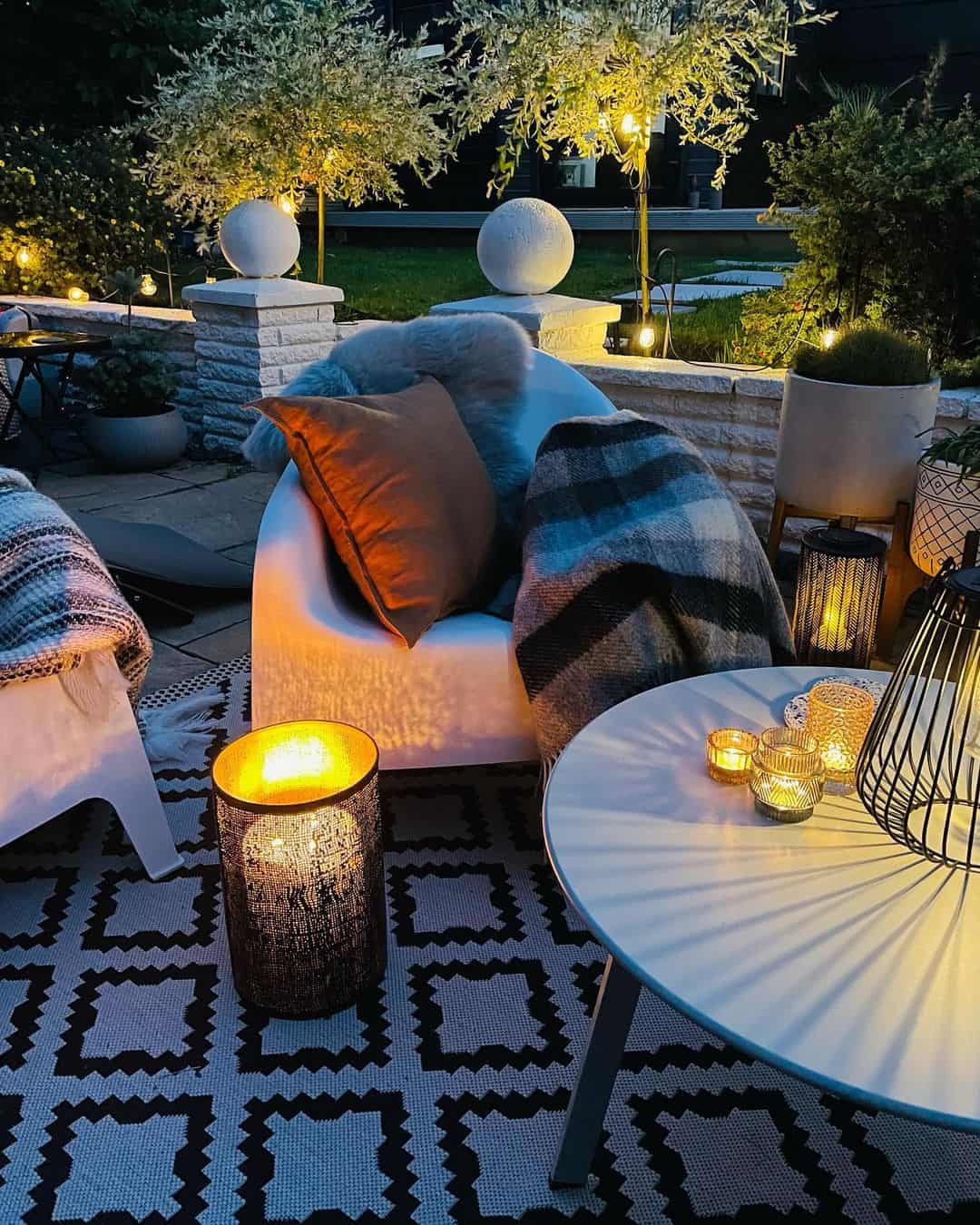 Textured Lanterns Cast Warm Light on Patio Coffee Table