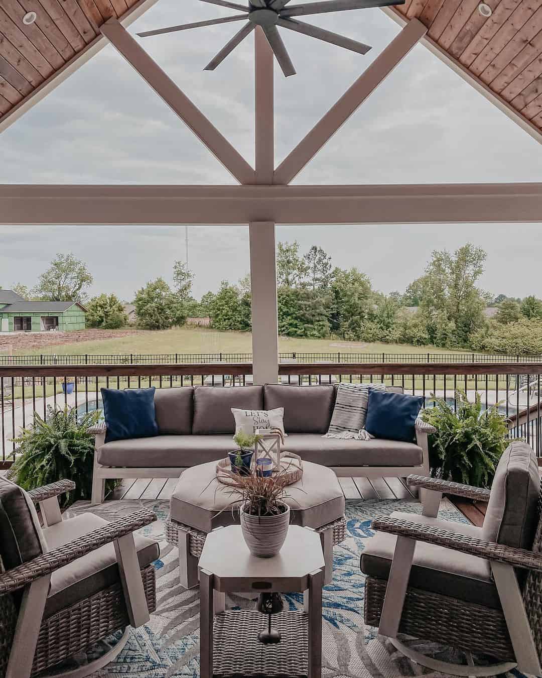 Woven Tray on Ottoman Holds a Lantern and Blue Accents