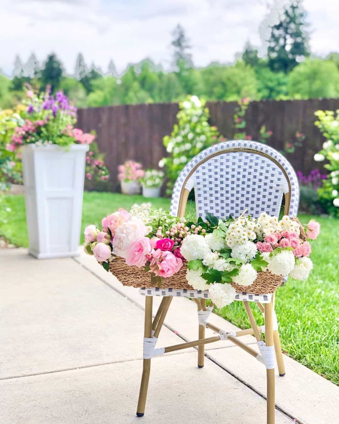 Woven Basket Overflowing With Blooms on Chair