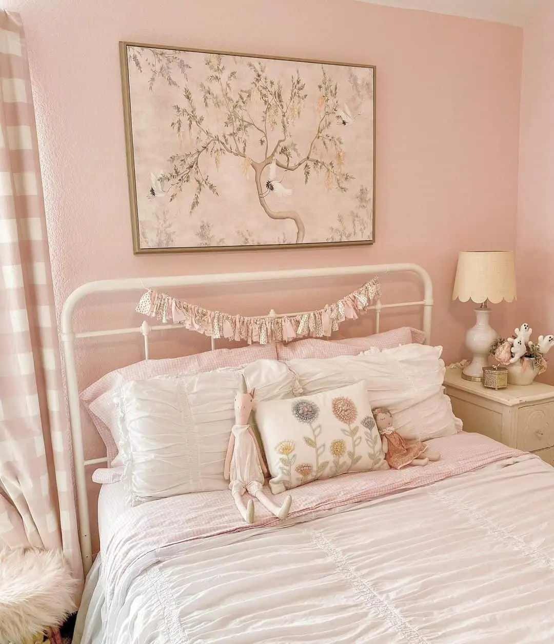 Whimsical Tree Artwork Adds a Soft Focal Point Above a Pink Bed