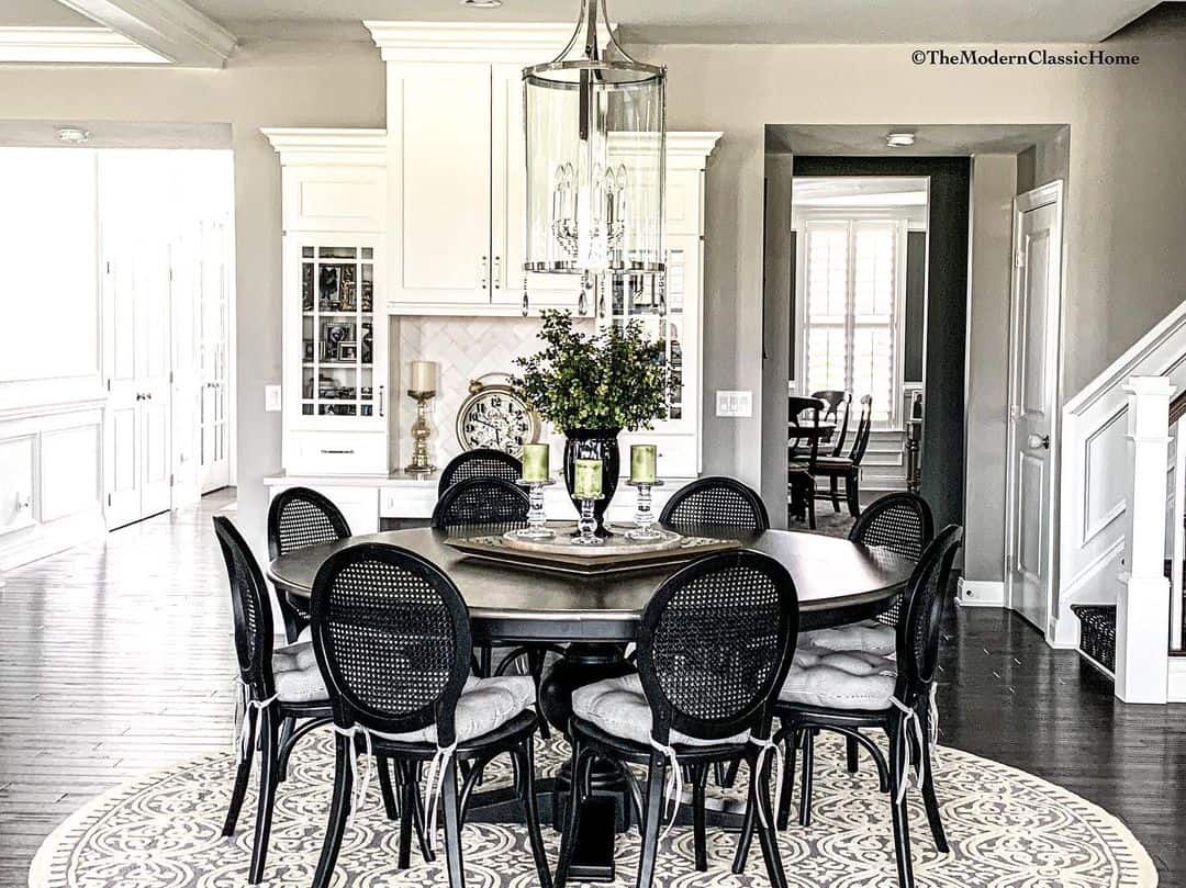Anchor Your Black Cane Dining Set With a Subtle Damask Rug