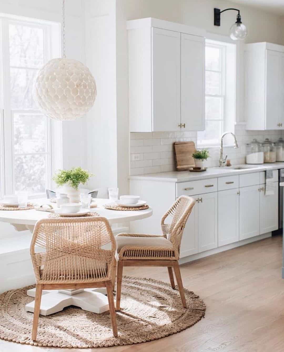 Pair Natural Woven Chairs With Round Jute Rugs