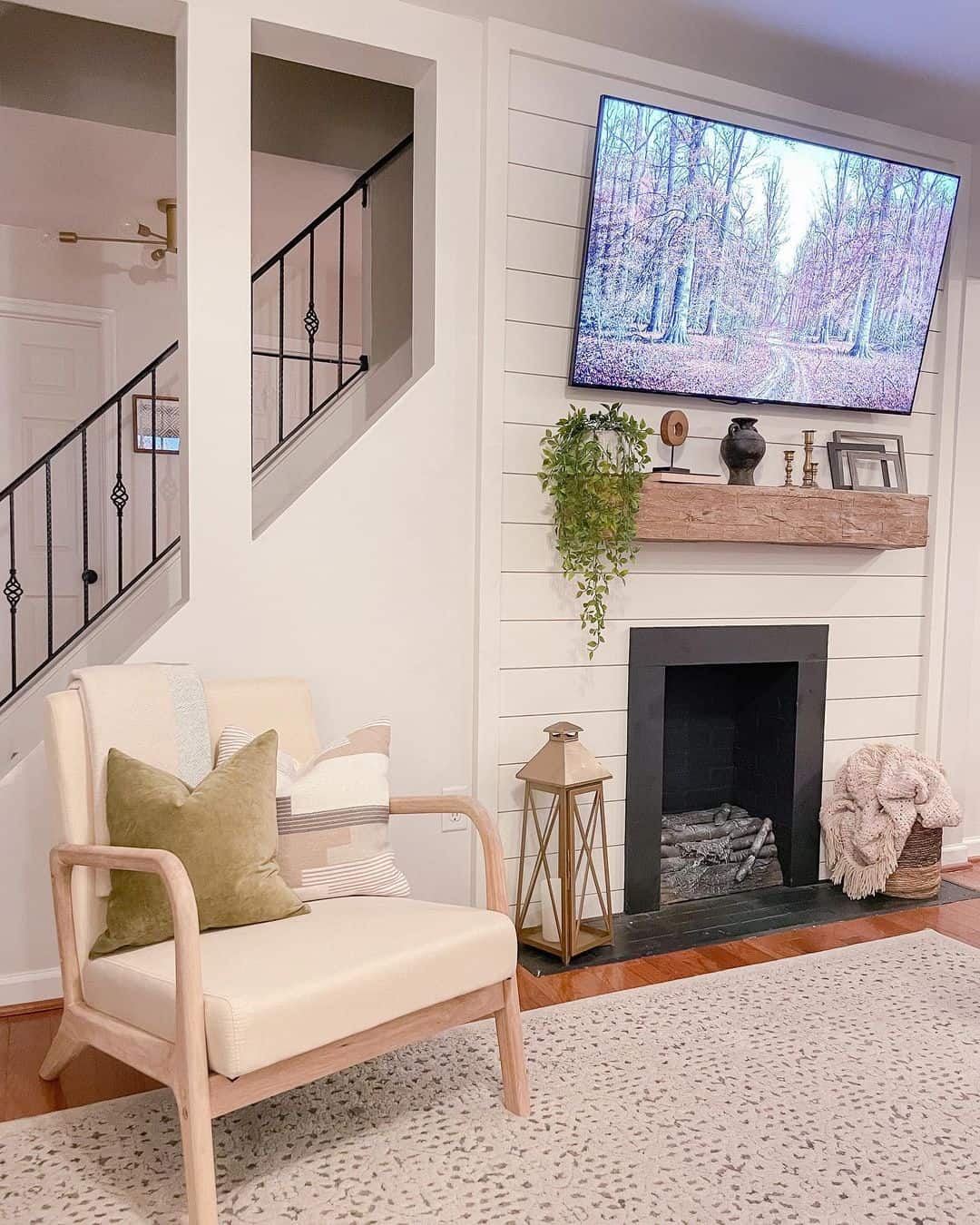Style a Rustic Mantel with Greenery and a Black Vase