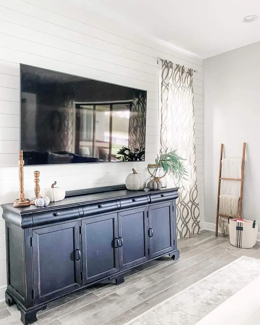Anchor Your TV with a Dark Cabinet and Seasonal Accents