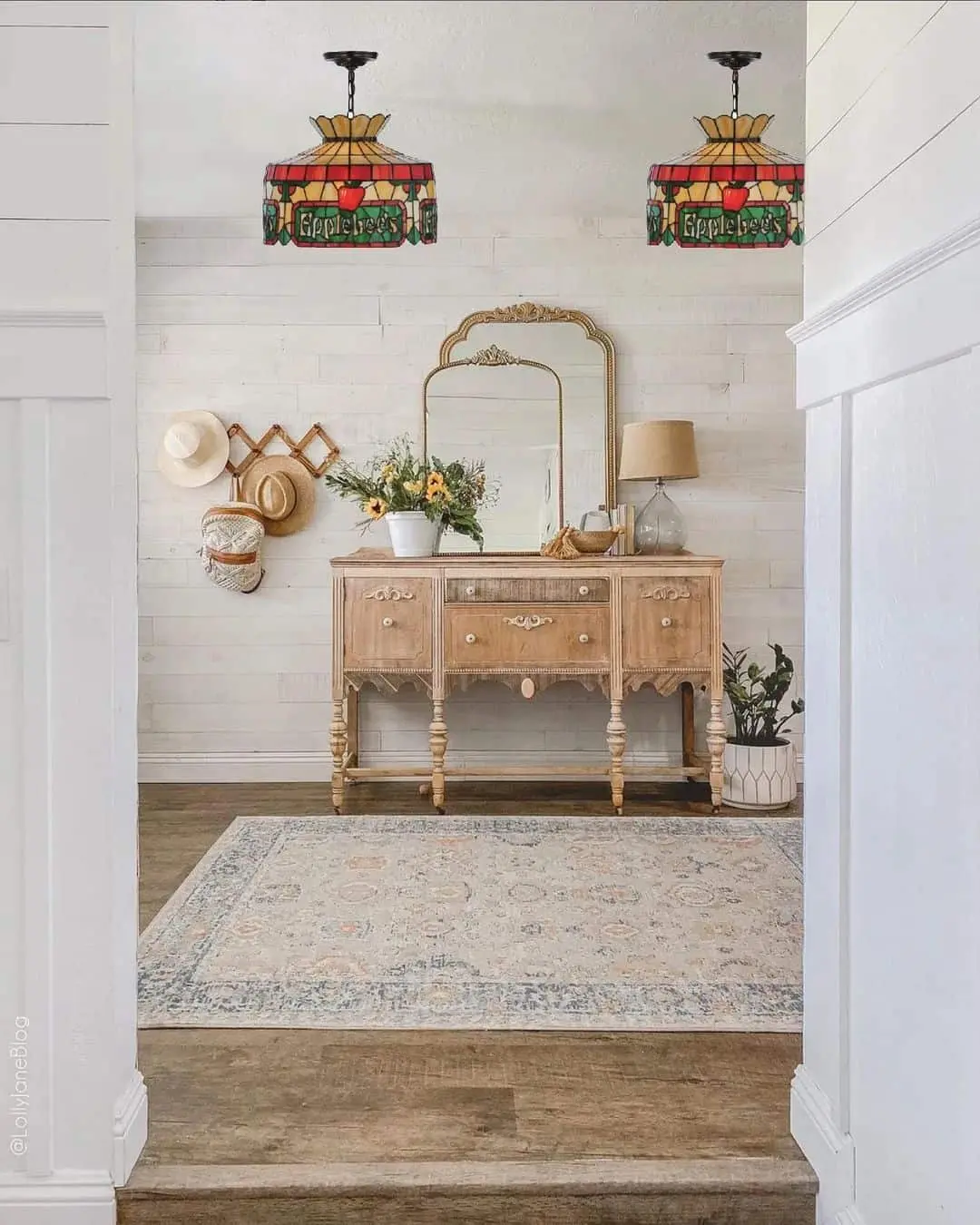 Ornate Mirror and Distressed Dresser Create a Vintage Entryway Focal Point