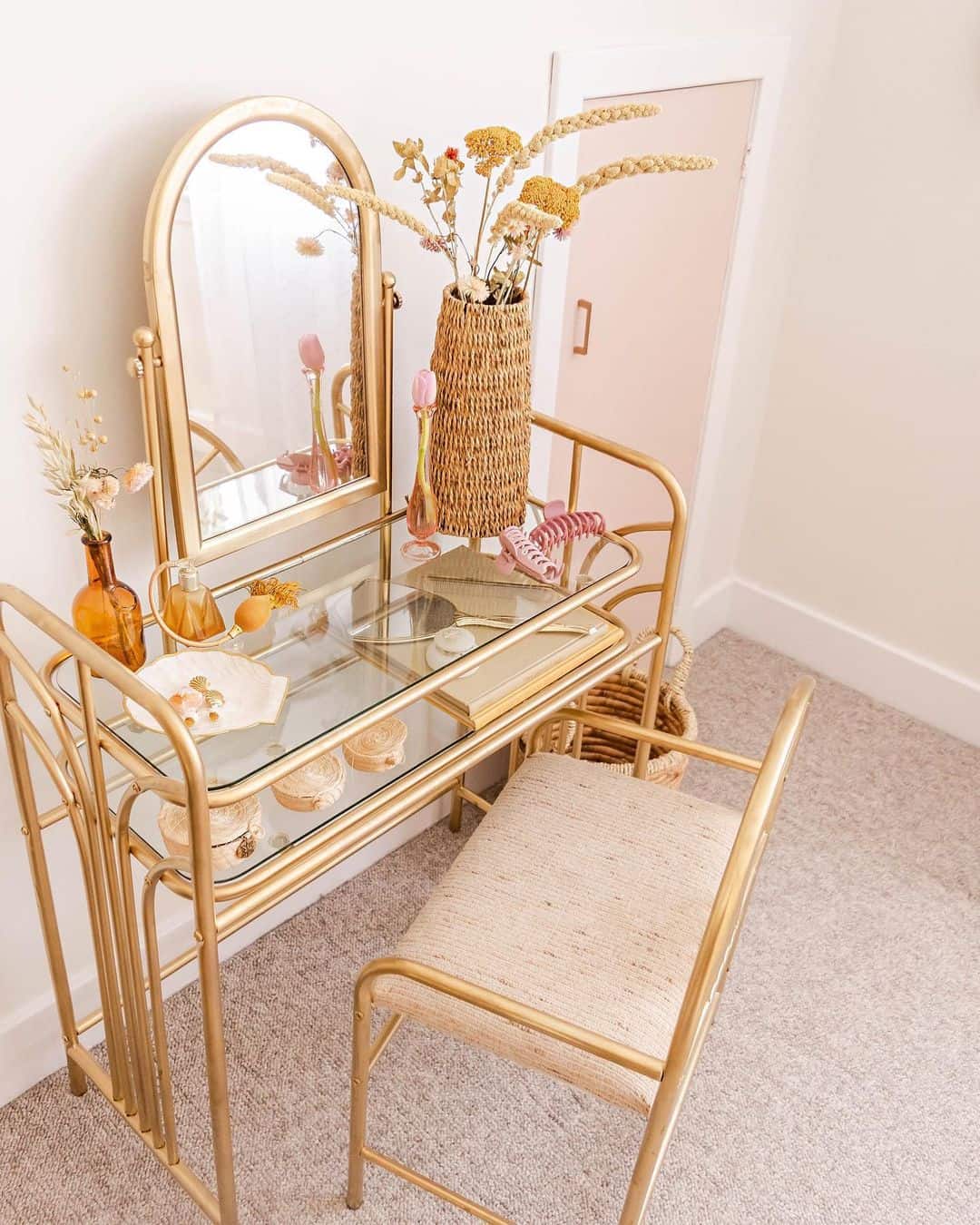 Combine Glamour and Nature with a Glass-Top Rattan Vanity