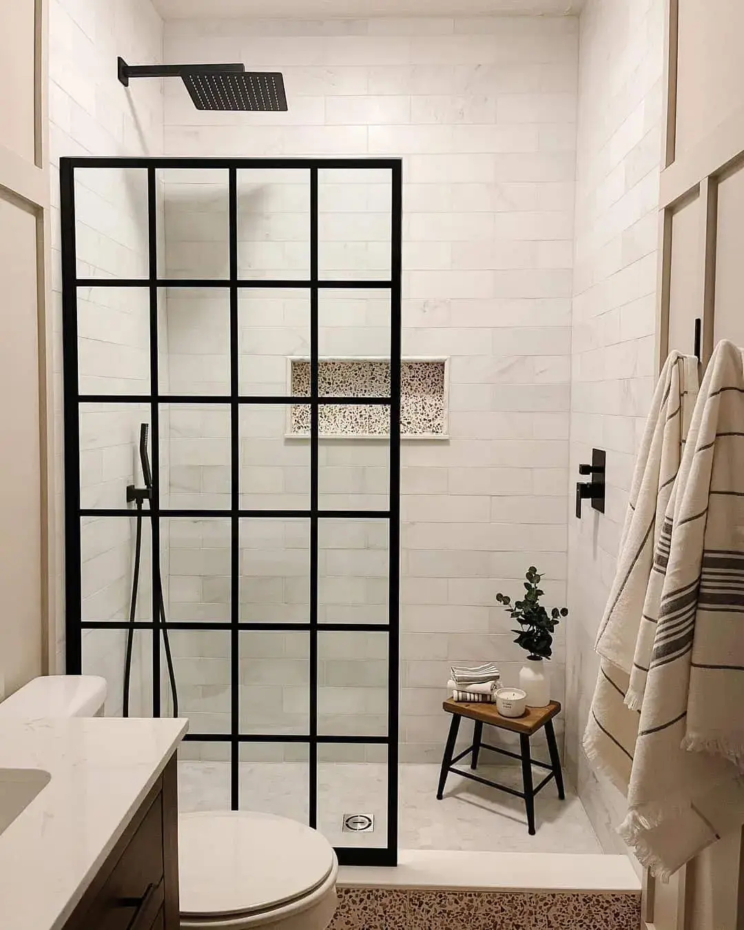 Framed Glass Shower Enclosure With Black Grid Pattern