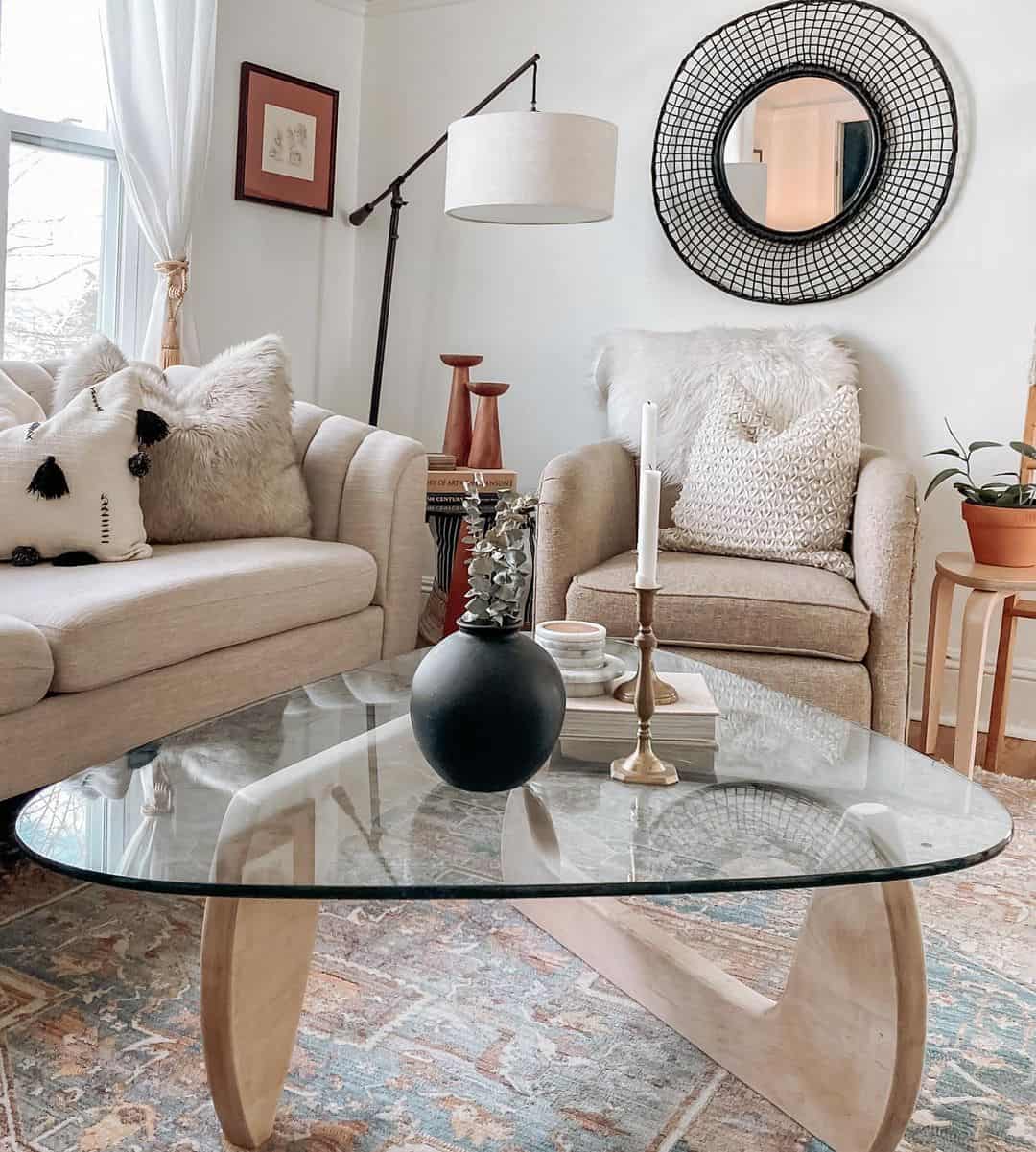 Round Wire Mirror Adds Graphic Texture Above a Neutral Chair
