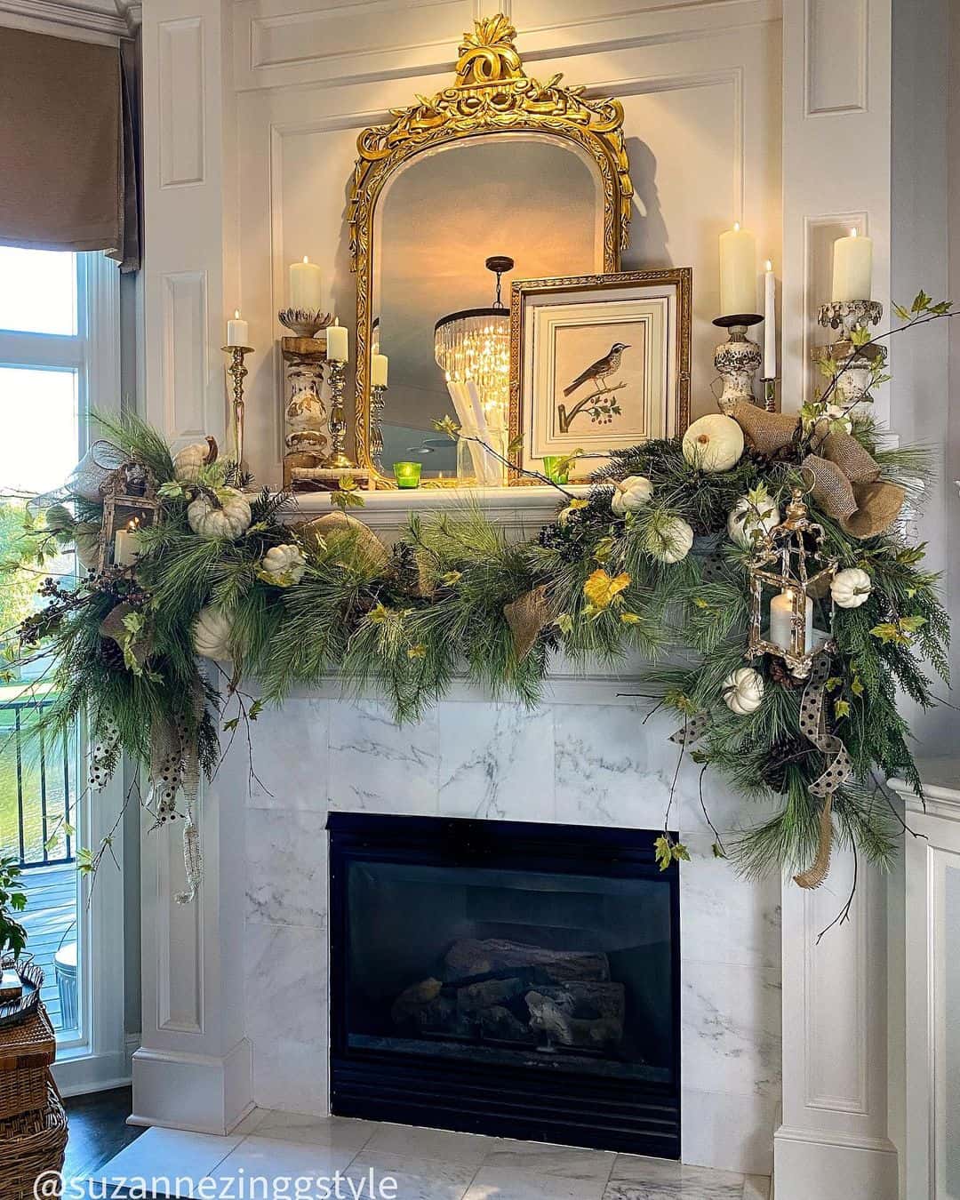 Ornate Gold Mirror Reflects Chandelier Above Mantel Decor