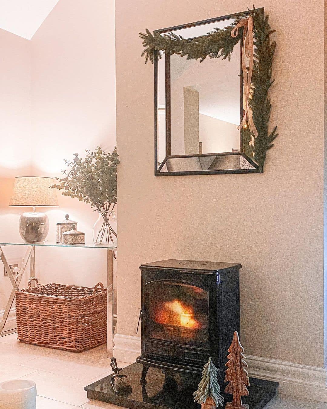 Square Mirror Frames a Cozy Fireside Vignette
