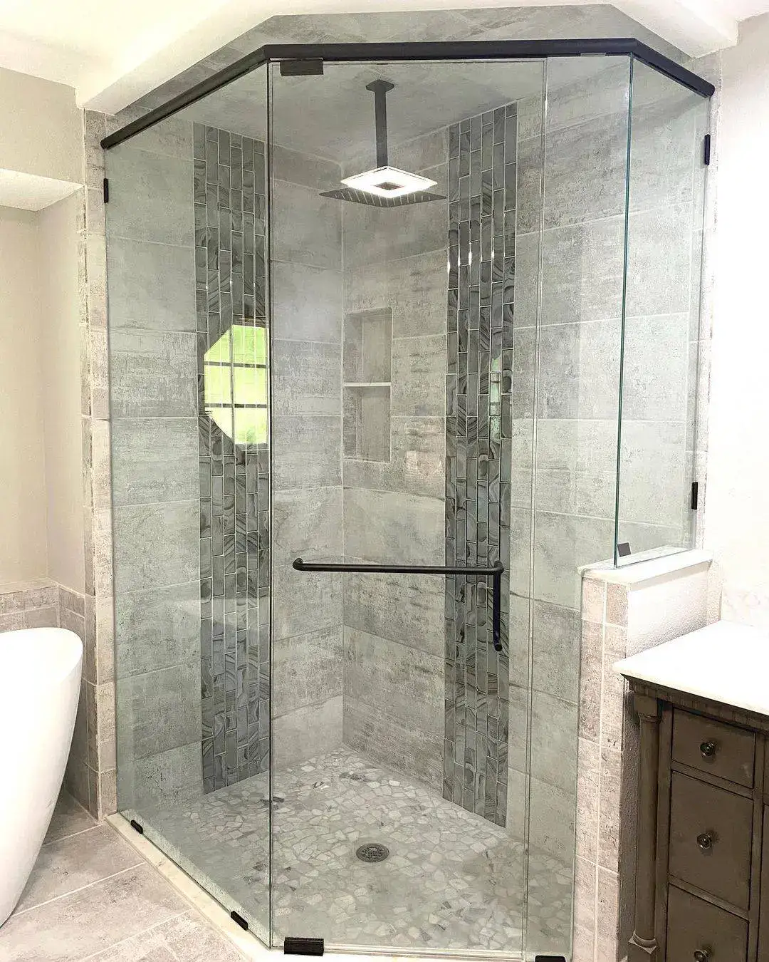 Vertical Mosaic Bands Frame the Shower's Center