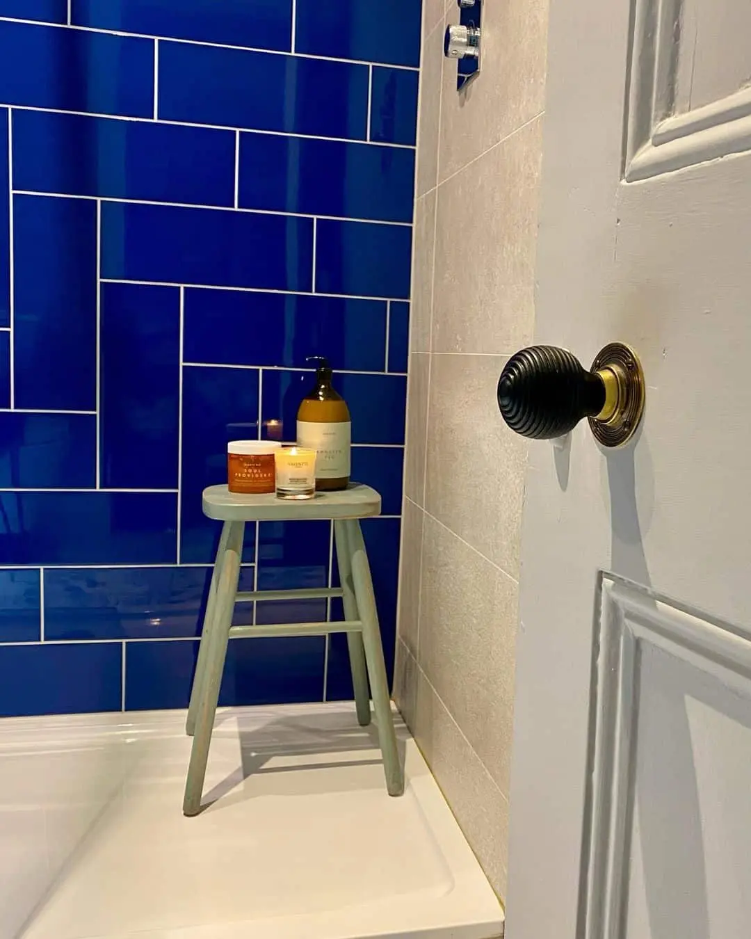 Glossy Blue Tile Creates a Bold Shower Accent Wall