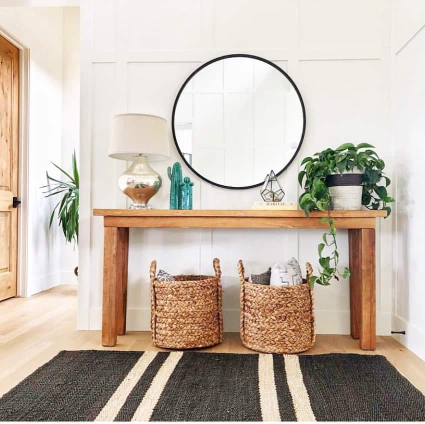 Two woven baskets add natural texture under the console