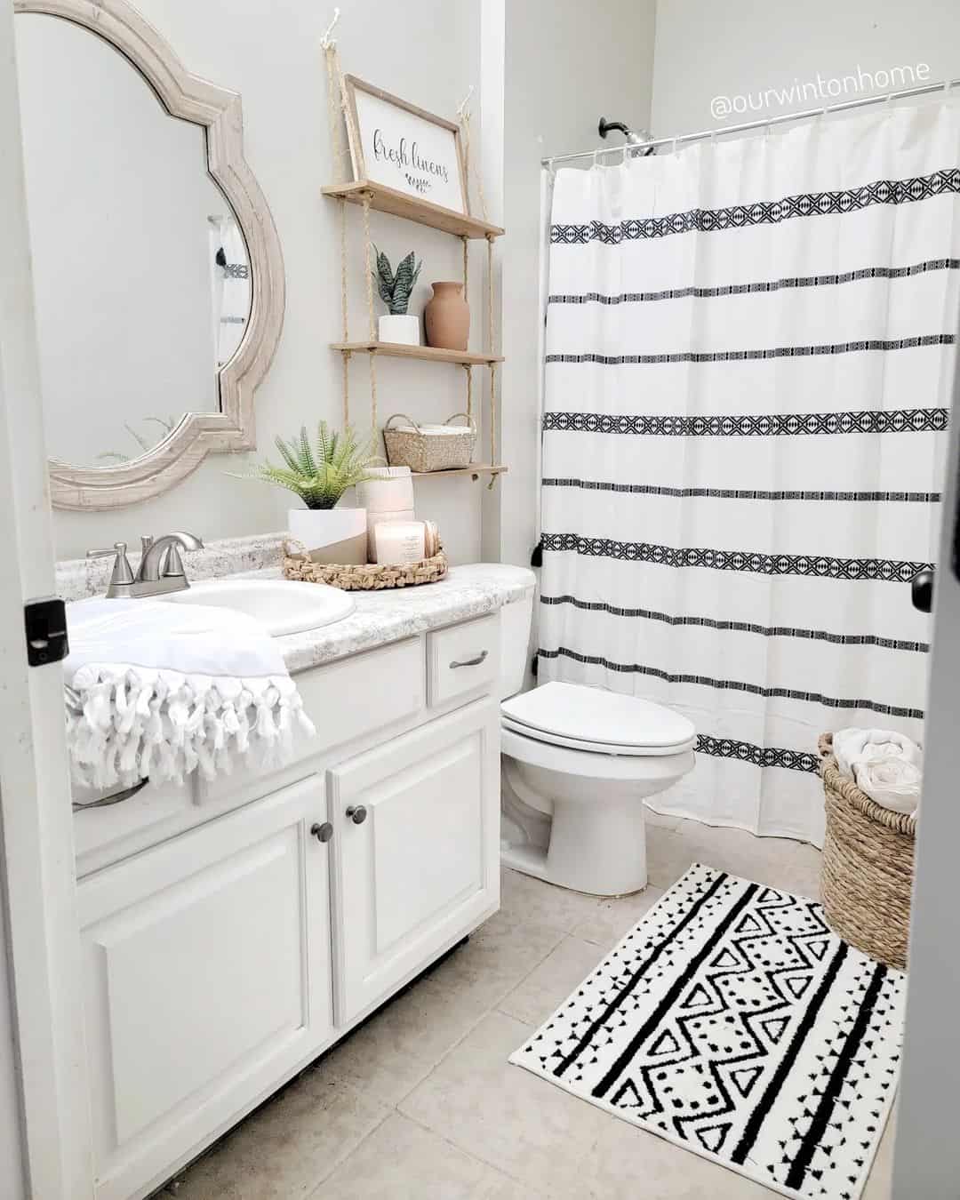 Graphic Black and White Rug Defines a Small Bathroom Floor