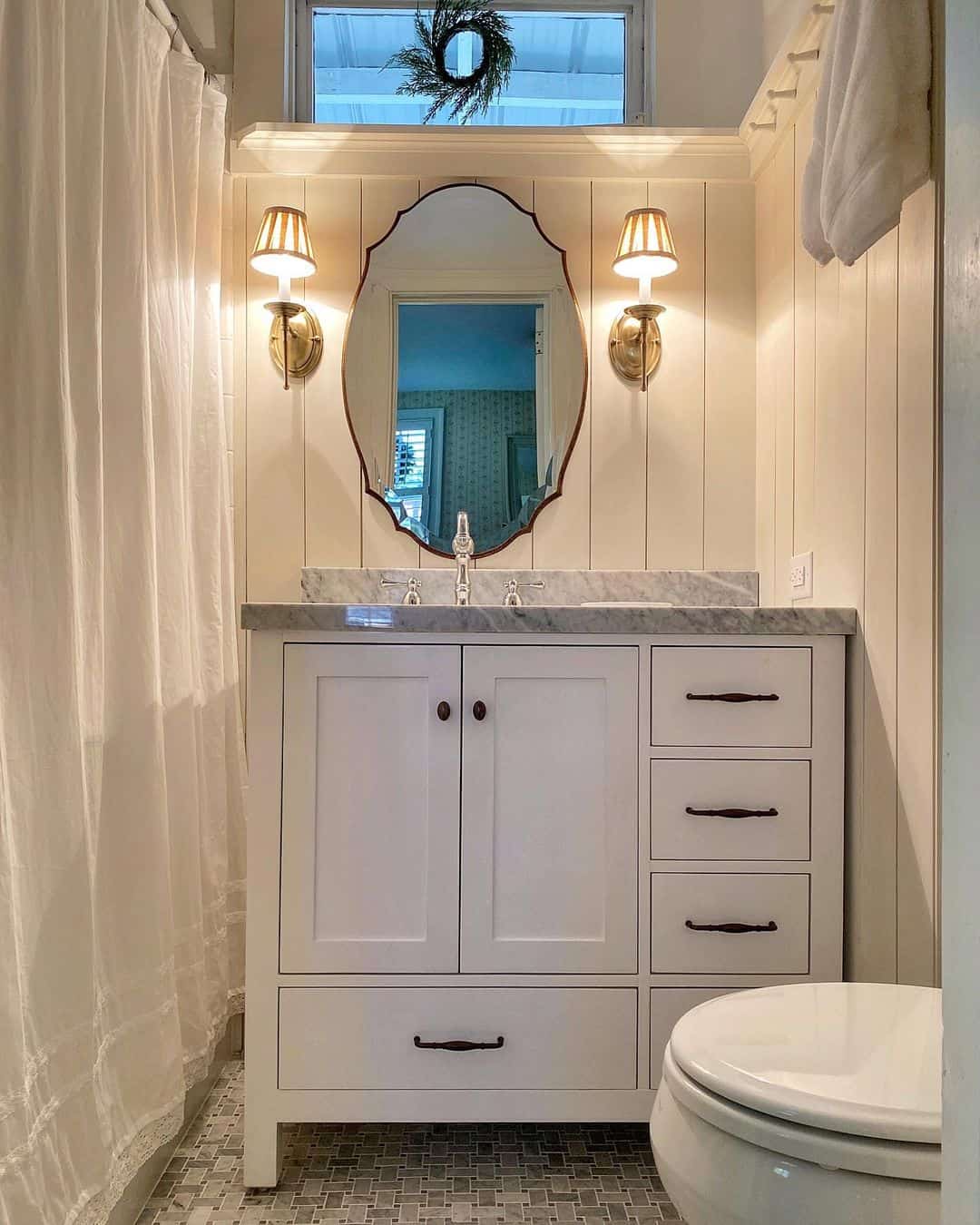 Brass Wall Sconces With Pleated Shades Add Warm Ambiance