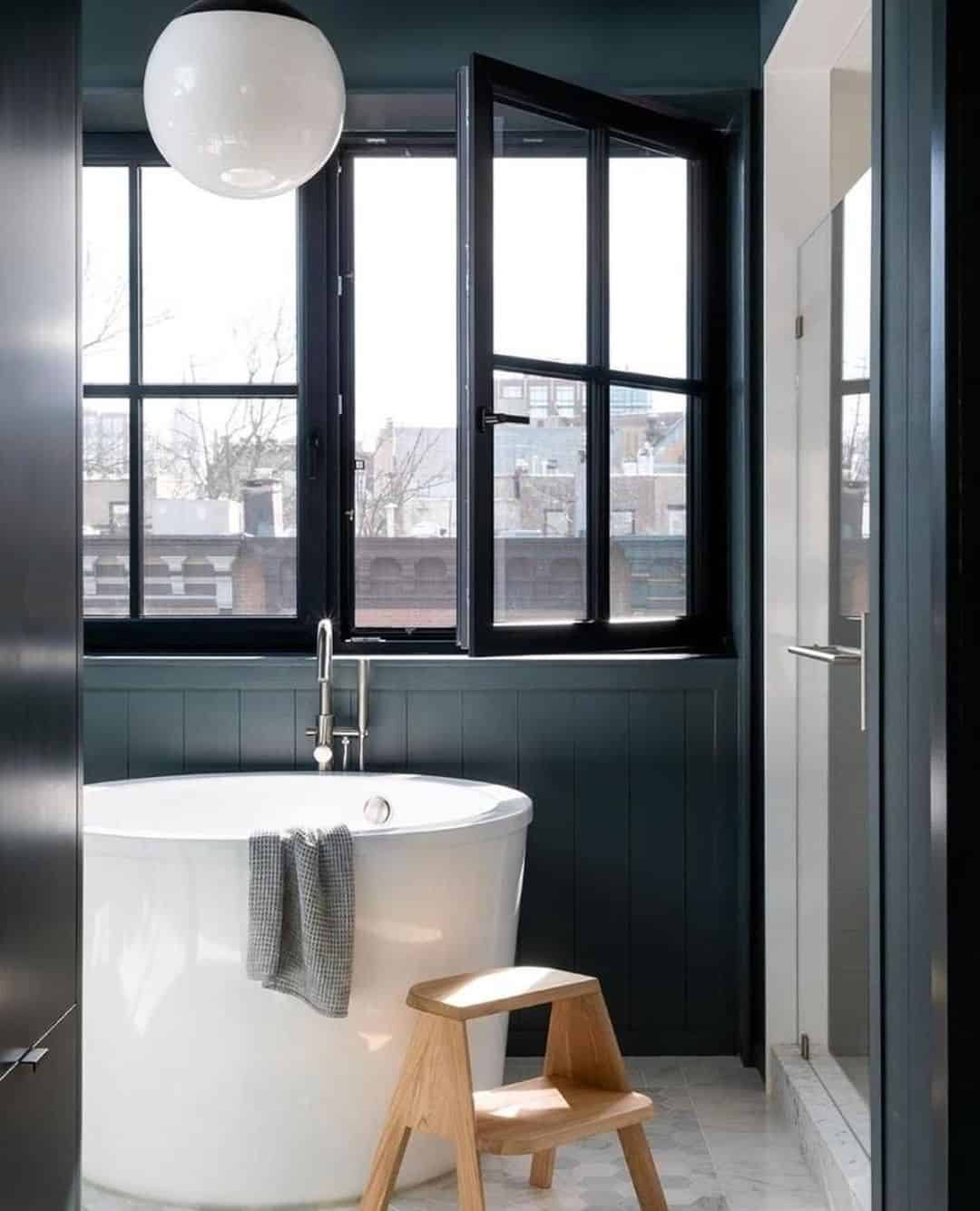 Oversized White Globe Pendant Light Brightens a Dark Bathroom
