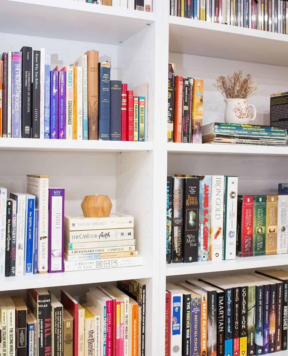 Stack books to create a platform for a wooden candle holder