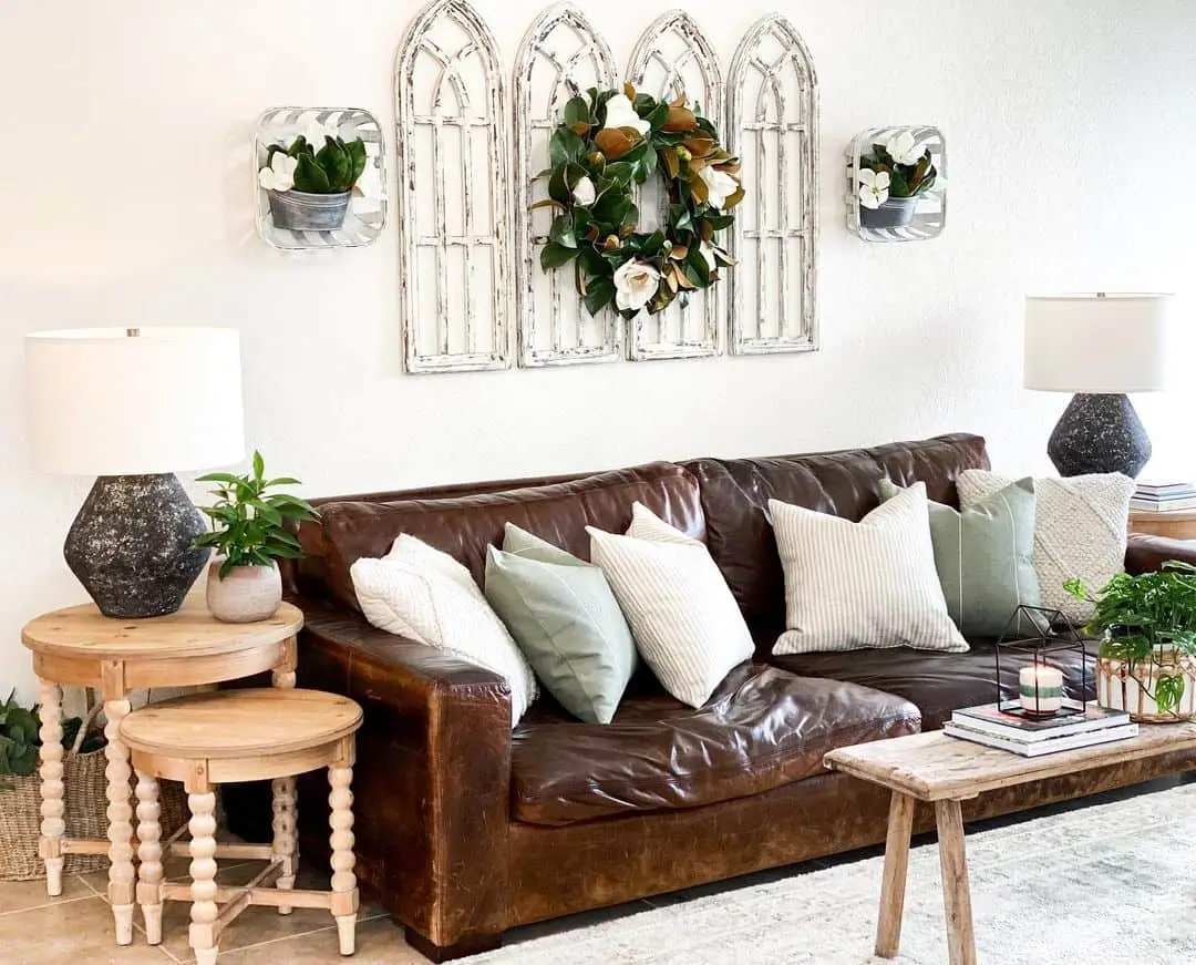 Distressed Arched Wall Panels Frame a Magnolia Wreath
