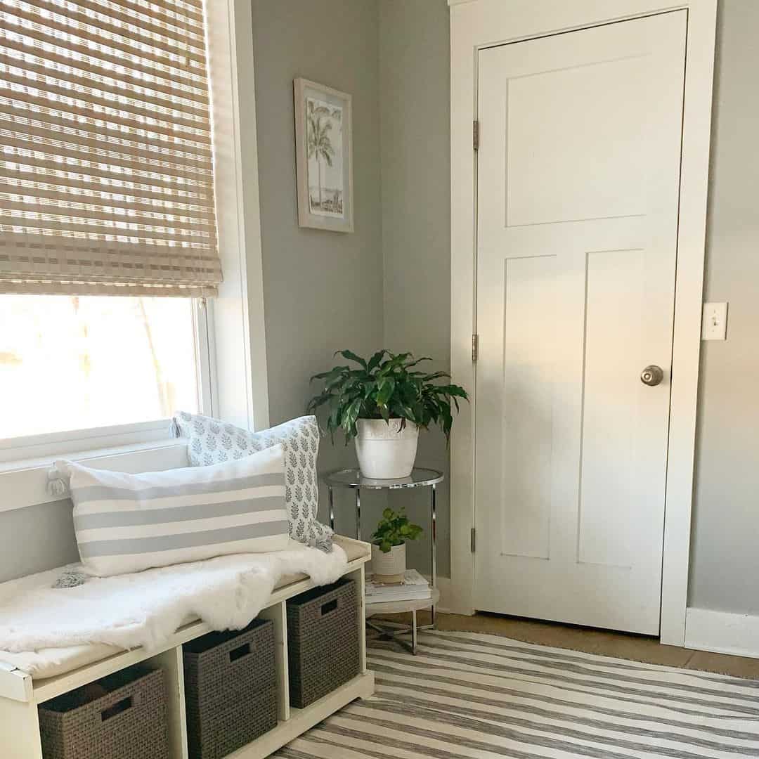 White Storage Bench with Striped Pillows