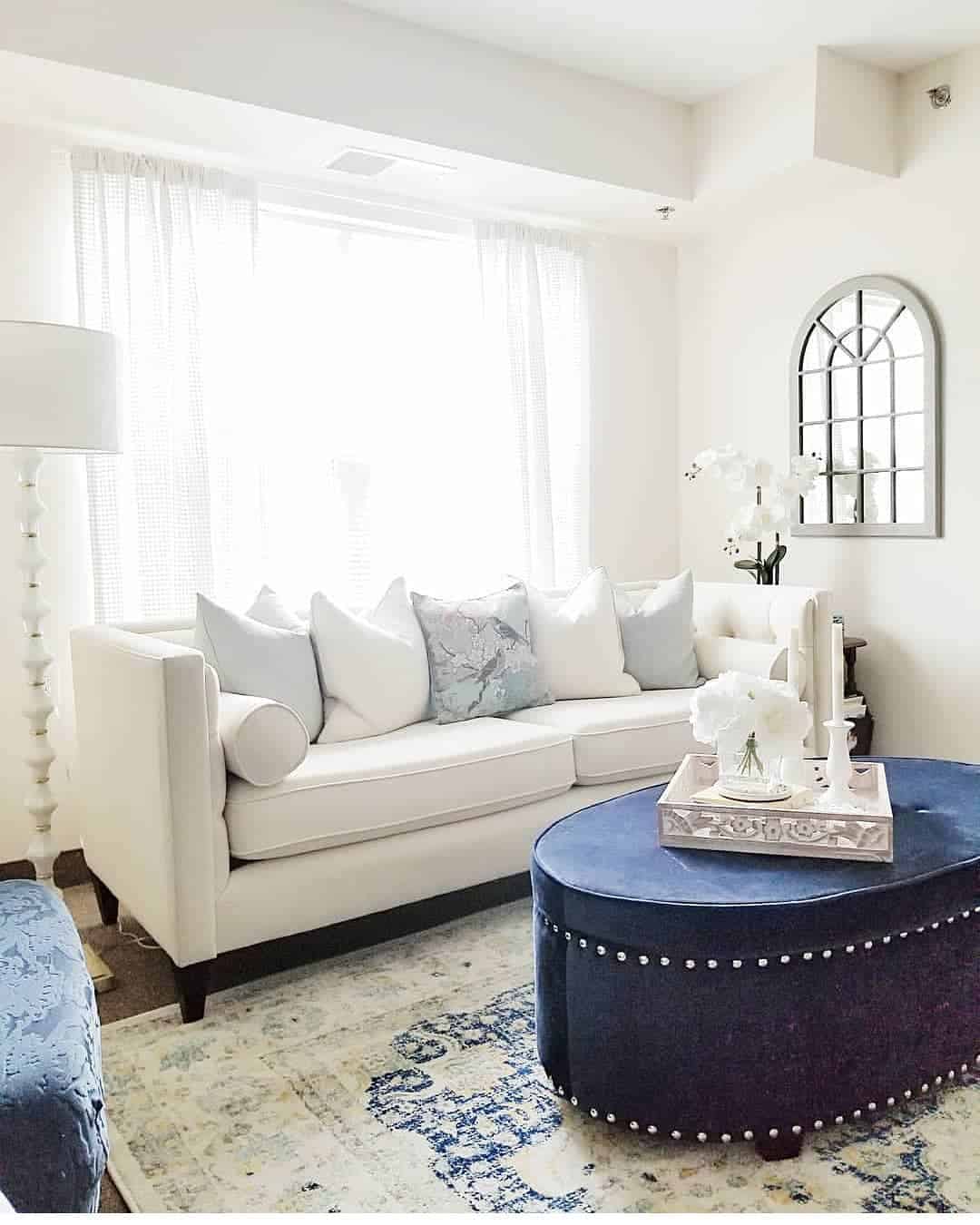 Deep Blue Ottoman with Studs as a Jewel-Tone Anchor