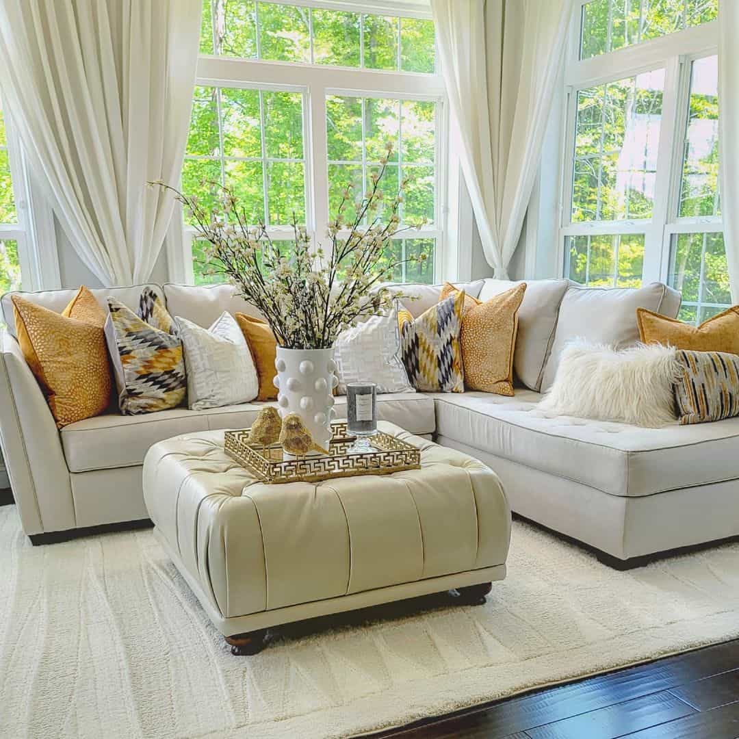 Cream Leather Ottoman Anchors a Bright, Airy Space