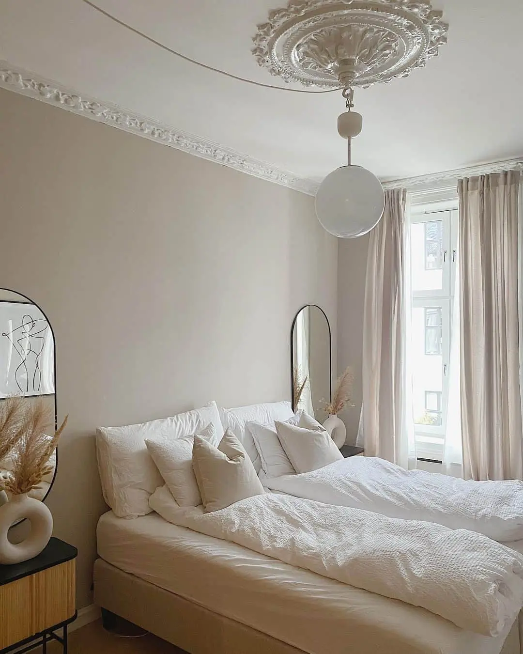 Frame Your Bed with Tall Oval Mirrors