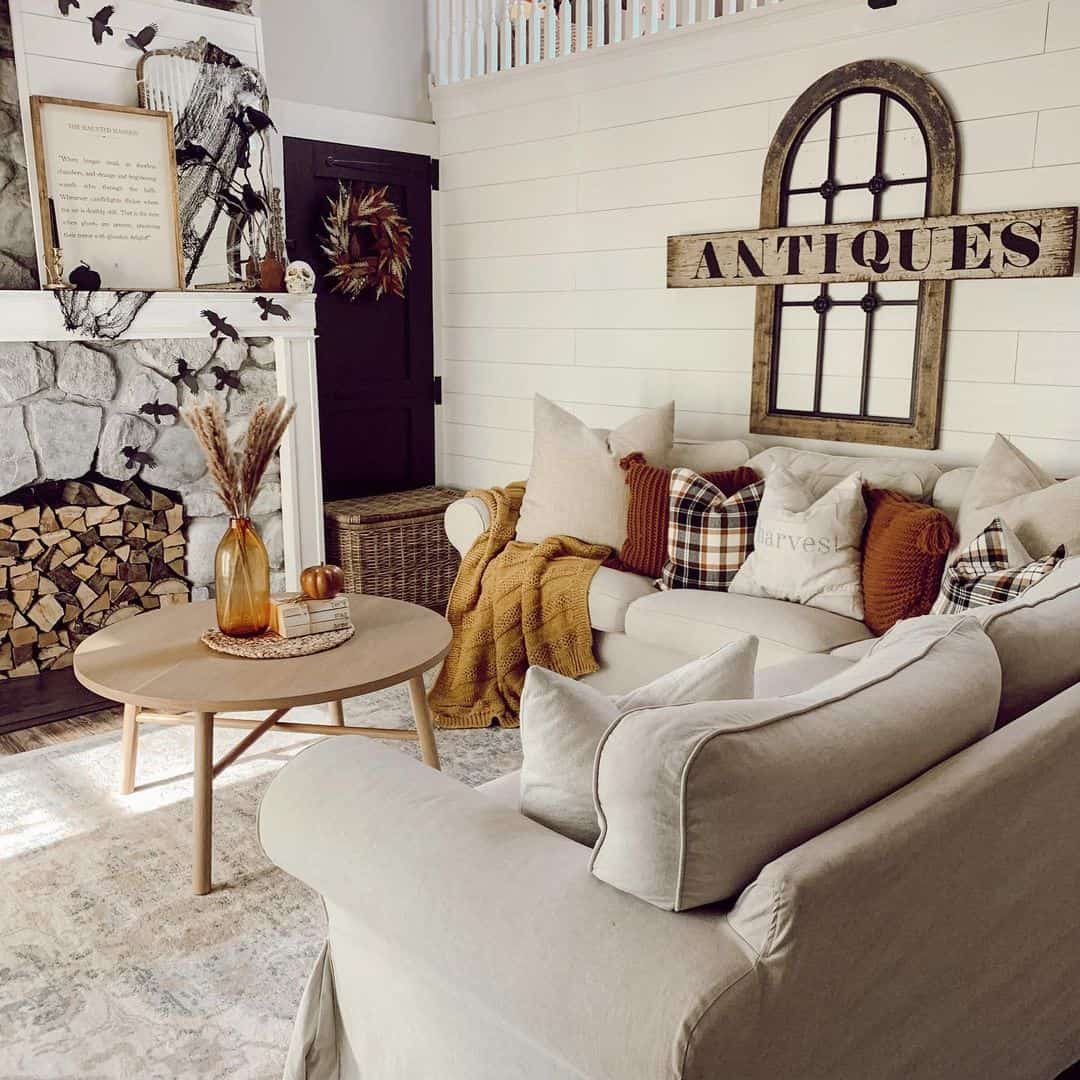 Anchor Your Seating Area with a Round Wood Table and Amber Vase